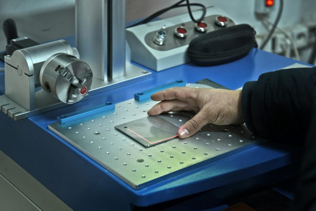 Precise hand control with laser technology in a laboratory setting, showcasing modern science.